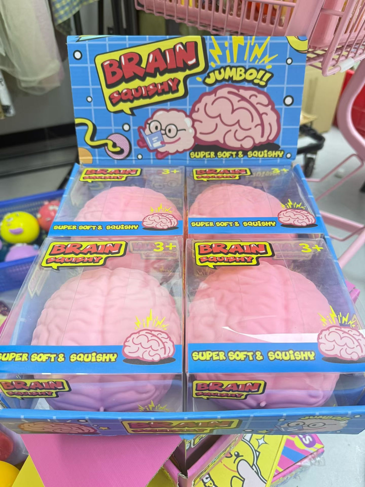 Jumbo pink brain squishy fidget toys in blue retail display packaging