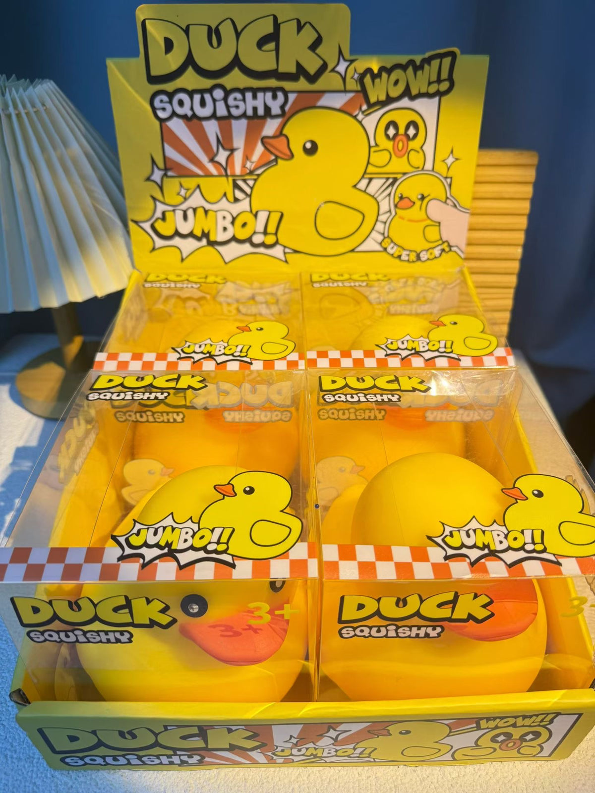 Jumbo yellow duck squishy fidget toys in clear retail display boxes