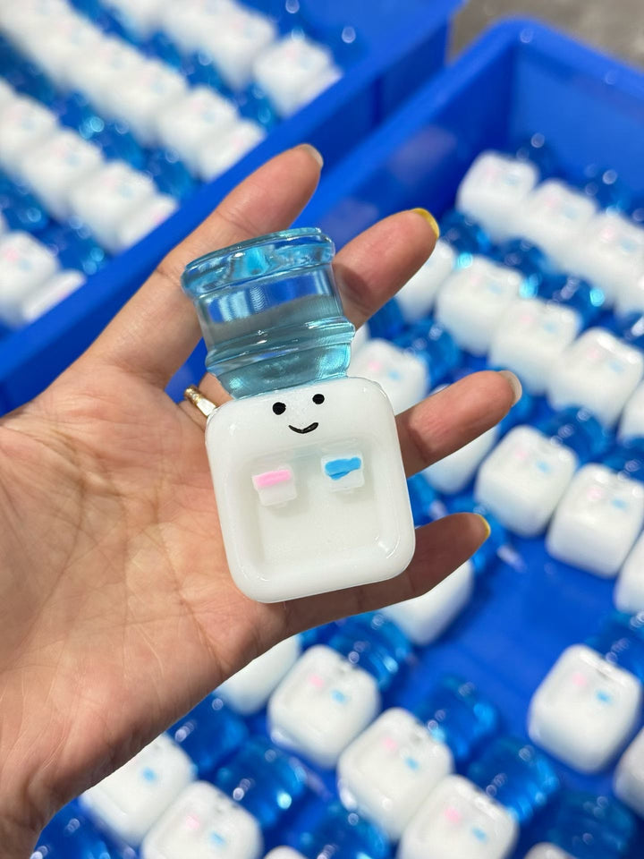 Mini white bottle character squishy fidget toy with a translucent blue cap