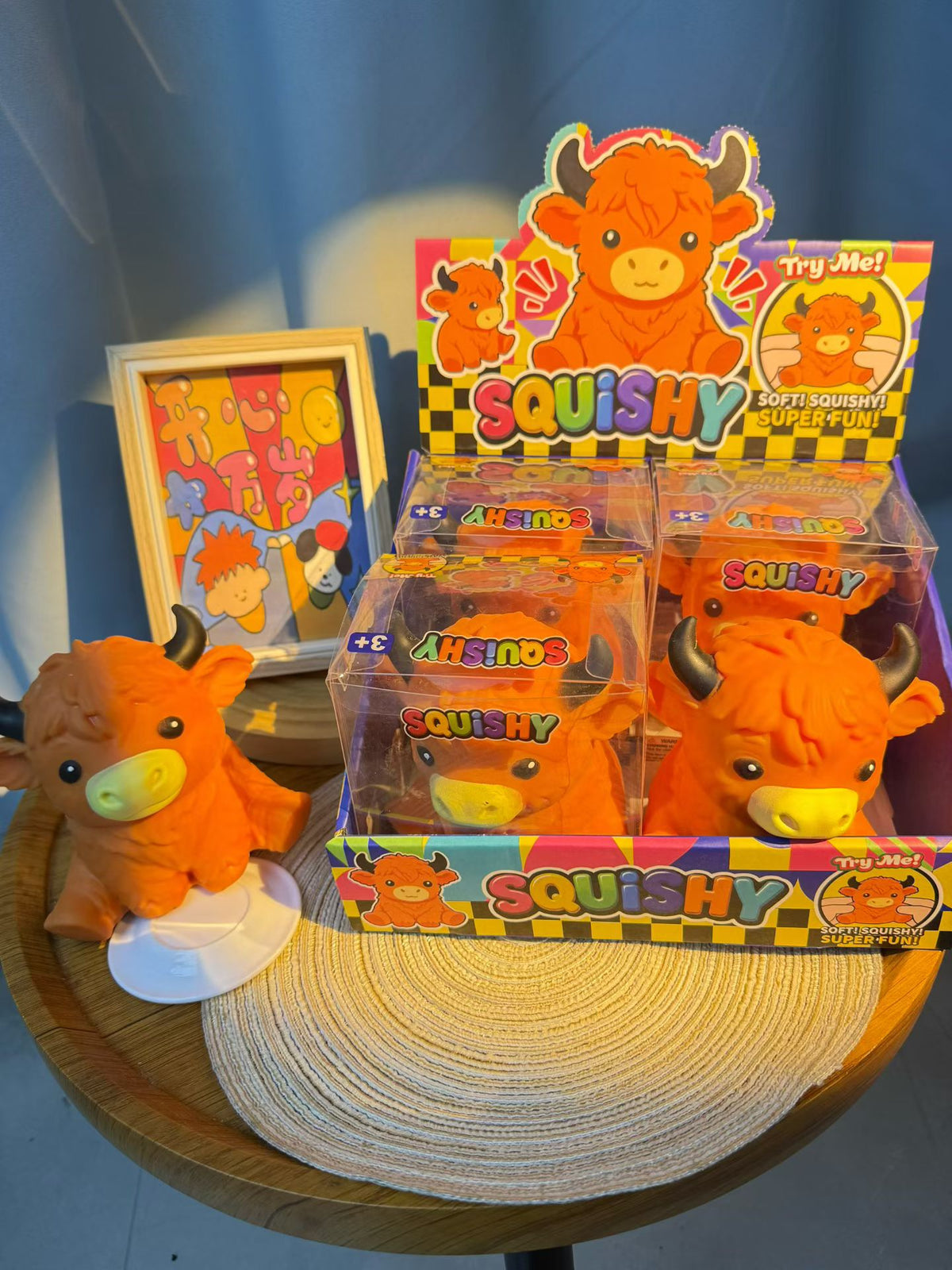 Orange Highland cow slow-rising squishies with retail display packaging