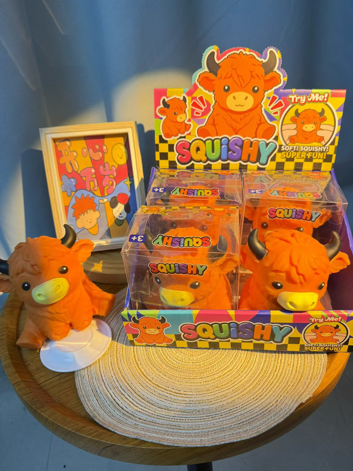 Orange Highland cow slow-rising squishies with retail display packaging