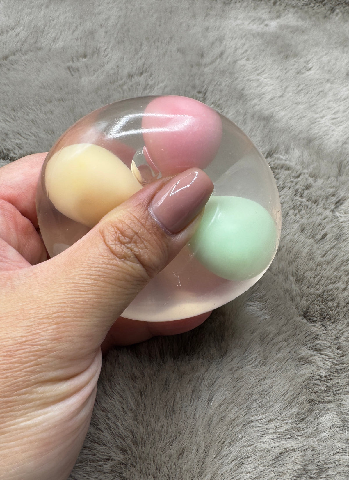 Macaron Party clear wax-cracking stress ball with yellow, pink, and mint inserts