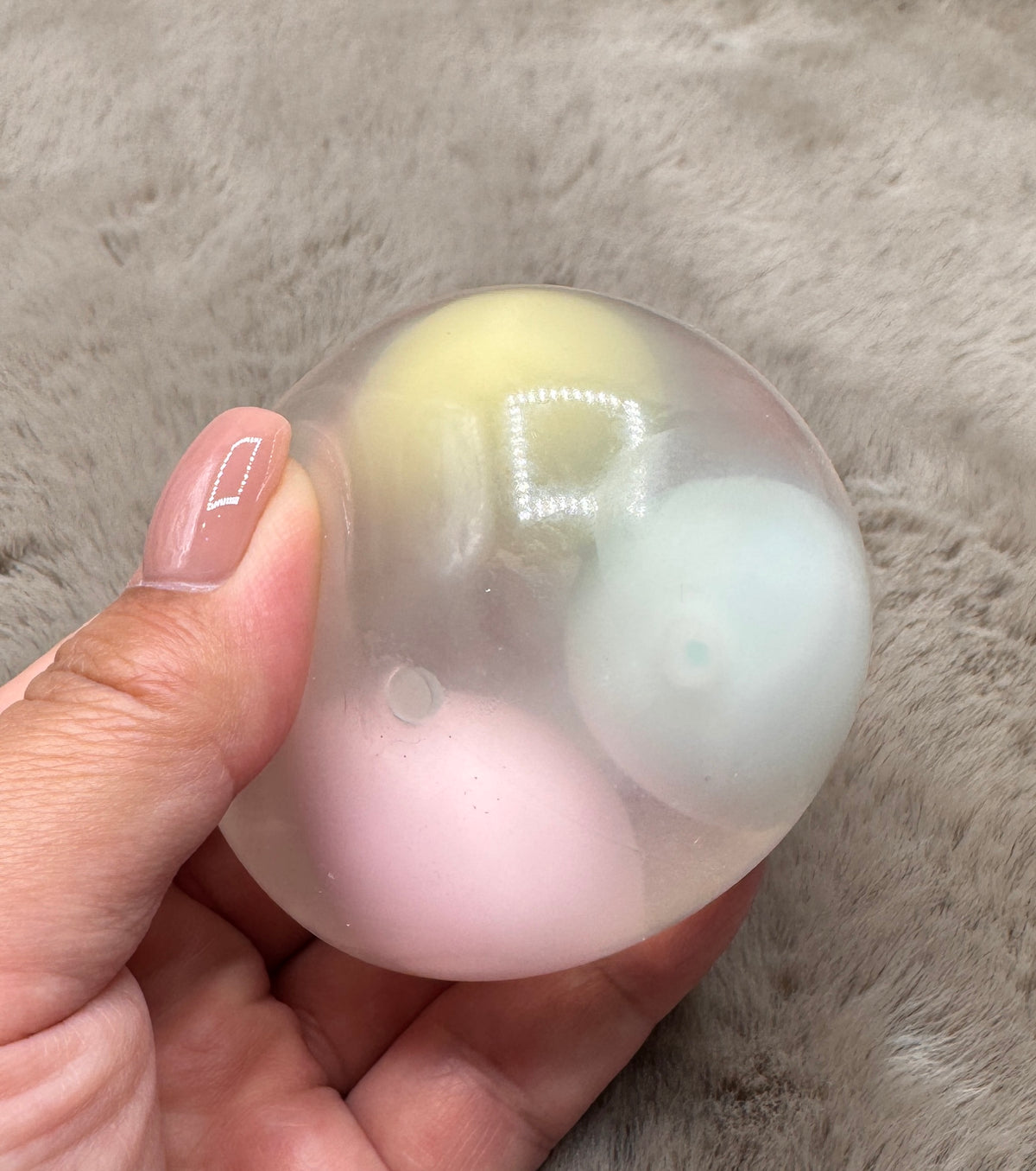 Pastel Daydream clear wax-cracking stress ball with yellow, pink, and blue inserts